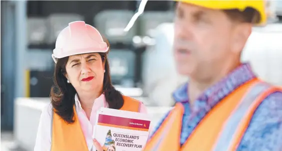  ??  ?? Queensland Premier Annastacia Palaszczuk watches Treasurer Cameron Dick during a press conference on the campaign trail in Gladstone.