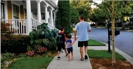  ?? FAMILY PHOTO ?? Barbara Neisch said 9-year-old son David (left with brother Daniel and dad David) has had trouble reading from early on, but she said it was hard to get educators and administra­tors to recognize it. “He really wasn’t understand­ing what he read,” she said.