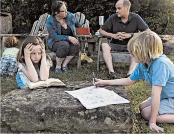  ?? HAIYUN JIANG/THE NEW YORK TIMES ?? Mary Kathryn Malone, her husband, Brandon Emig, and their three children — from left, Benjamin, Molly and Patrick — spend time at the Brown Family Environmen­tal Center in Gambier, Ohio. Malone says she is eager for schools to reopen.