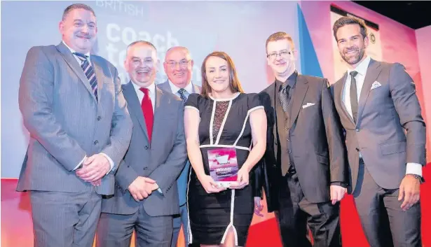  ??  ?? The Edwards team picking up Coach Tour Operator of the Year award at the British Coach Tourism Awards, for being the best in the business with a fleet of more than 15 coaches. With them is awards compere Gethin Jones, far right