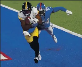  ?? SETH WENIG — THE ASSOCIATED PRESS ?? Pittsburgh Steelers wide receiver JuJu Smith-Schuster comes down with a touchdown pass against New York Giants cornerback James Bradberry (24) in the fourth quarter.