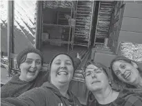  ?? PHOTO BY LOIS CRASWELL ?? From left, Miranda Lowther, Lois Craswell, Katelyn Craswell and Stephanie Leavitt taking a happy and relieved selfie in front the reefer truck provided by Atlantic Beef Products. It helped them save much of their stock after the power outage caused by Dorian.