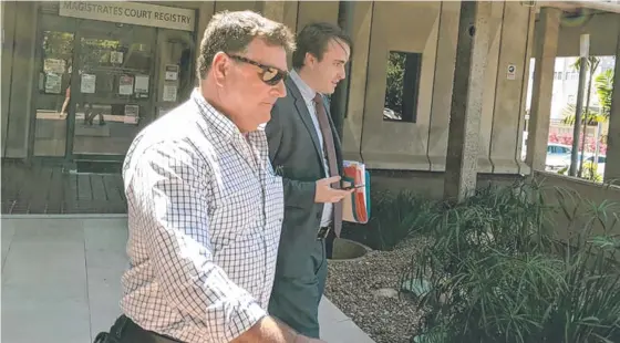  ??  ?? Guucci Roofing Pty Ltd director Mal Pirret leaves court after the company was fined $50,000.