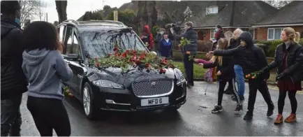  ?? Picture: Steve Smyth ?? REMEMBERED: Crowds lined the streets for the funeral of Olly Stephens