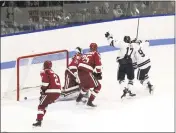  ?? Steven Musco / Yale Athletics ?? Kevin O’Neil (17) celebrates his first-period goal with a teammate Saturday night against Harvard.