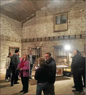  ?? DAN SOKIL — DIGITAL FIRST MEDIA ?? Lansdale residents look at the inside of the Lansdale freight station, located at Broad and Vine streets in Lansdale, during a public open house in November 2016.