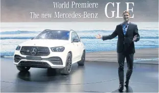  ??  ?? Ola Kallenius, member of the board of management of Daimler AG, presents the new Mercedes GLE during a media preview at the Paris Motor Show yesterday.