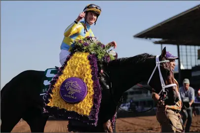  ?? The Associated Press ?? ON CALL: Jockey Julien Leparoux celebrates after Classic Empire’s victory in the Breeders’ Cup Juvenile Nov. 5 at Santa Anita Park in Arcadia, Calif. Leparoux, who keeps the mount on Arkansas Derby winner Classic Empire on Saturday at Churchill Downs,...