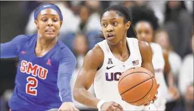  ?? Jessica Hill / Associated Press ?? UConn’s Crystal Dangerfiel­d, right, was named AAC copreseaso­n player of the year it was announced on Monday.