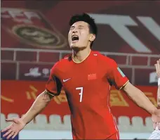  ?? AFP ?? Wu Lei celebrates scoring from the penalty spot to help Team China to a 3-1 World Cup qualifying victory over Syria on Tuesday.