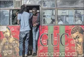  ?? Photos: Andrew Renneisen/getty Images ?? Blinged out: Matatus in Nairobi evolved from plain-looking jalopies into manyangas, cosy rides with ostentatio­us bodywork and exteriors embellishe­d with avant-garde artwork.