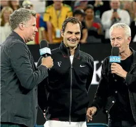  ?? GETTY IMAGES ?? Will Ferrell (L) and John McEnroe (R) interviewe­d Roger Federer after Federer won his first round match against Aljaz Bedene.