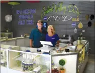  ?? RECORDER PHOTO BY ALEXIS ESPINOZA ?? Steve Penn (left) and Kerry Douglas (right) stand behind the regiser of their new store Central Valley Pure CBD. It is the first licensed CBD store in Tulare County.