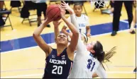  ?? Noah K. Murray / Associated Press ?? UConn’s Olivia Nelson-Ododa (20) goes to the basket against Seton Hall’s Alexia Allesch on Tuesday.