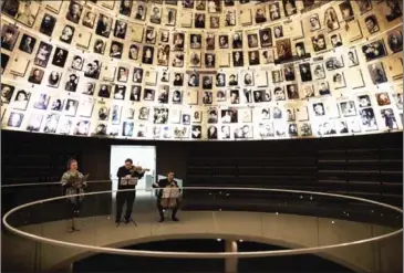 ?? MENAHEM KAHANA/AFP ?? An ensemble performs at the Yad Vashem Holocaust Memorial in Jerusalem in November.