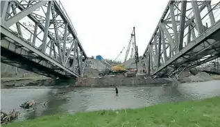  ?? COURTESY UZ ?? A railway bridge near Kyiv being rebuilt in mid-April following the withdrawal of Russian forces. Exactly how the bridge was damaged in the first place has not been revealed, and it could have been deliberate­ly damaged by the Ukrainian army to slow down the Russians.