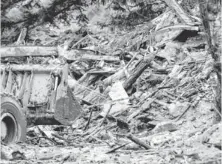  ?? POOL PHOTO BY RICK WILKING ?? A loader moves debris Wednesday at the scene of the mudslide in Oso, Wash. The debris is taken in partial loads.