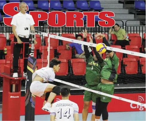  ?? ?? Iloilo D’Navigators’ Kyle Angelo Villamor smashes the ball towards the defense of Philippine Army Defenders in the recent PNVF Champions League.