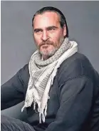  ?? TAYLOR JEWELL/INVISION/AP ?? To play John Callahan, Joaquin Phoenix studied video of the quadripleg­ic cartoonist and worked with a rehabilita­tion hospital.