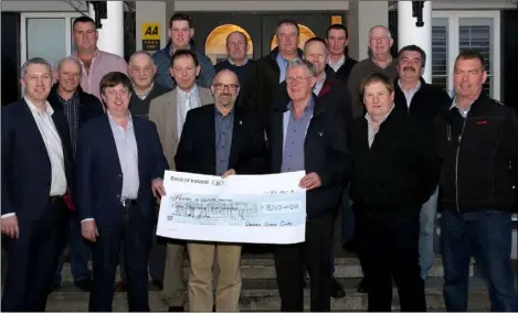  ??  ?? Colm Neville, on behalf of the Friends of Wexford Hospital’s MRI Now campaign, accepts the cheque for €8,110, the proceeds of a vintage tractor run.