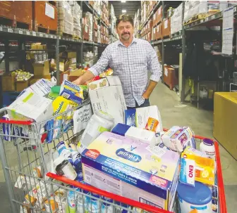  ?? ARLEN REDEKOP ?? Greater Vancouver Food Bank CEO David Long is seen inside the agency’s warehouse in Burnaby this week. The food bank is in need of a new temporary distributi­on centre in Vancouver.