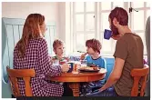  ?? ?? Chatting with your children around the table at mealtimes is one way to help them become more socially confident