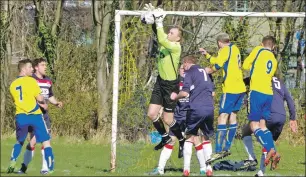  ??  ?? Saints keeper Thomas McCulloch comes out confidentl­y to collect this corner kick.