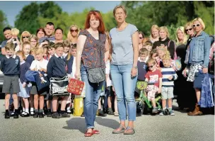  ??  ?? ●● Kirsty Keogh and Beki Lancaster (front) are part of a campaign to stop a car park and playing fields being sold off in Poynton