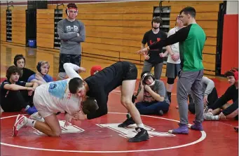  ?? CHRIS CHRISTO — BOSTON HERALD ?? Assistant coach Dylan Finlay directs practice for the Bridgewate­r-Raynham wrestling team this week. Bridgewate­r-Raynham is 23-3-1 and red hot.