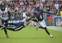  ?? ?? Ravens wide receiver Zay Flowers, right, was one of the league’s most ballyhooed rookies in the preseason, and he wasted little time showing he will get open against pro defenders and leave them grasping for air with his sudden cuts and spins.