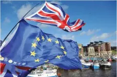  ?? — AFP ?? Anti-brexit activists fly EU flags as fishing boats take part in a demonstrat­ion on the River Tyne in Newcastle, northeast England, on Friday, against the terms of the current Brexit deal being offered by Britain’s Prime Minister Theresa May.