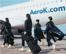  ?? Captured from Matin Kim’s website ?? Aero K Airlines’ cabin crew uniform designed by Matin Kim