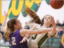  ?? File photo ?? Canyon’s Talia Taufaasau (3) goes for a shot as Valencia’s Mailey Ballard (2) guards her at Canyon on Friday, Feb. 9. The Cowboys beat the Vikings for the Foothill League title.