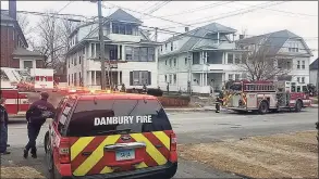  ?? Danbury Fire Department / Contribute­d photo ?? On Jan. 19, 2019, while on patrol, Danbury Police Officer Emilio Masella noticed a fire on a second floor porch in the 100 block of Rose Hill Avenue in Danbury. He immediatel­y called in the fire department. Danbury police and fireighter­s are among the city’s highest-paid employees.