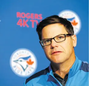  ?? MICHAEL PEAKE / POSTMEDIA NEWS ?? Blue Jays general manager Ross Atkins’s task is to reshape a team that is old, slow and ill-fitting throughout the active roster.