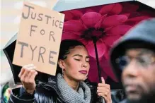  ?? Gerald Herbert/associated Press ?? Protesters march Saturday in Memphis, Tenn., over the death of 29-year-old Tyre Nichols, who died three days after being beaten by Memphis police during a traffic stop.