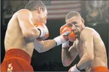  ?? Joe Cavaretta Associated Press ?? JOSE LUIS CASTILLO lands a left to the face of Diego Corrales during their 2005 lightweigh­t title unificatio­n bout.