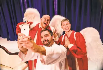  ?? Contribute­d photo ?? TheatreWor­ks New Milford’s recent production of “An Act of God,” by David Javerbaum, featured, from left, Josh Newey, Matt Austin and Suzanne Powers.