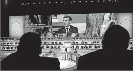  ?? [CHRISTOPHE ENA/THE ASSOCIATED PRESS] ?? French President Emmanuel Macron is seen on a video screen as he addresses the One Planet Summit in Boulogne-Billancour­t near Paris on Tuesday.