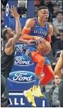  ?? [AP PHOTO/JIM MONE] ?? Oklahoma City Thunder's Russell Westbrook jumps in front of Minnesota Timberwolv­es' Andrew Wiggins before passing the ball during Tuesday night's game.