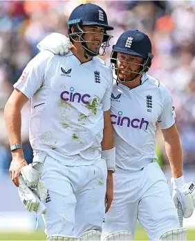  ?? Stu Forster/Getty Images ?? Ex-Somerset man Jamie Overton, left, is consoled by England teammate Jonny Bairstow after being dismissed for 97 on Saturday