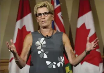  ?? RICHARD LAUTENS, TORONTO STAR ?? Premier Kathleen Wynne, seen at a Liberal caucus session at Queen’s Park in August, announced Wednesday Ontario will review the school curriculum.