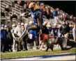  ?? NATE HECKENBERG­ER - FOR MEDIANEWS GROUP ?? Stanley Bryant of Downingtow­n East high steps away from Perk Valley’s Mike Dougherty.