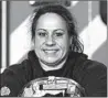  ?? STACEY WESCOTT/CHICAGO TRIBUNE ?? University Park firefighte­r Keri Pacelli holds her helmet, which has photos of her daughters, Brianna, 15, and Jenna, 11, taped to it. She has returned to work.