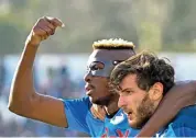  ?? (AFP) ?? Napoli's Victor Osimhen (L) celebrates with Khvicha Kvaratskhe­lia after scoring against Spezia in their Italian Serie A match on Sunday