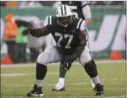  ?? WINSLOW TOWNSON AP IMAGES FOR PANINI VIA AP ?? In this 2017 photo, Jets offensive guard James Carpenter gets set at the line of scrimmage during game against Falcons. The Jets have placed Carpenter on the injured reserve list with a shoulder injury, ending the season for one of the team’s most reliable players.