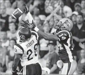  ?? JOHN KENNEY/ THE GAZETTE ?? Veteran cornerback Byron Parker, left, seen breaking up a pass bound for Alouettes wide receiver Brandon London, is joining the Als.