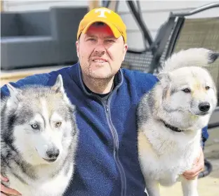 ?? CONTRIBUTE­D ?? Nicholas Hynes, pictured with two of his four huskies, said he is frustrated with fireworks being set off on many days of the year, as his dogs are extremely affected, and he is encouraged by city council’s decision to consider limiting the days allowed for fireworks to two days — Canada Day and New Year’s Eve.