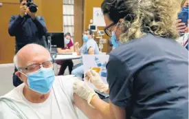  ?? AP ?? A healthcare worker receives Pfizer-BioNTech COVID-19 vaccine during a nationwide vaccinatio­n programme at the American University Medical Center in Beirut, Lebanon, on Sunday.