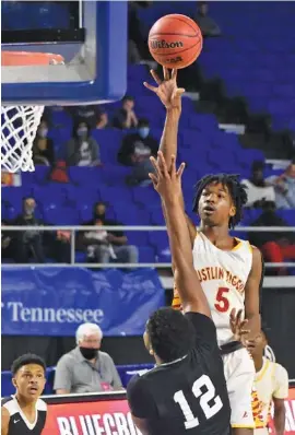  ??  ?? Howard’s Kerrick Thorne shoots as Jackson South Side’s Jaylan Cole defends during a TSSAA Class AA state quarterfin­al Thursday at Middle Tennessee State in Murfreesbo­ro. Howard lost 59-51, ending its season with a 19-6 record.